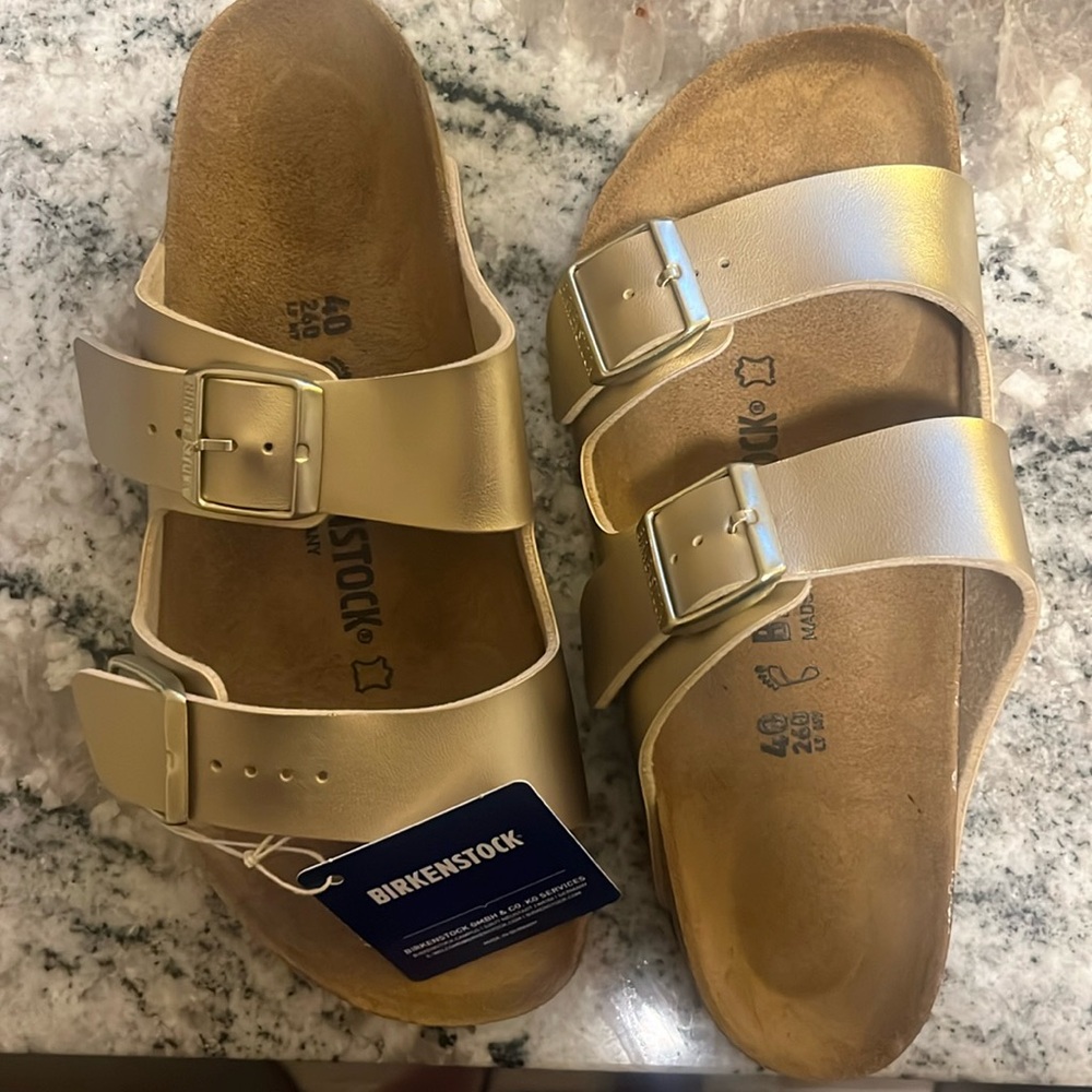 Birkenstock size 40 brand new never worn, gold.